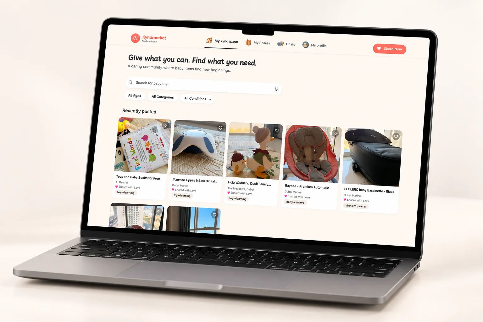 Kyndmarket website on a laptop: a caring community marketplace where baby items are shared